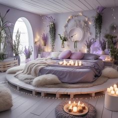 a circular bed with lots of candles on it