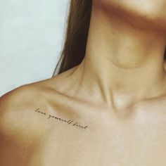 a woman's chest with the words love is beautiful written on her left shoulder