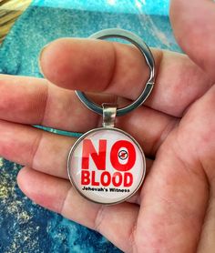 This glass cabochon silver keychain with white background reading "NO BLOOD".  *  Handcrafted  *  Measures 1 inch in diameter  o ~ TURNAROUND TIME ~ Our up to date production times can be found in our shop announcement section and typically range from 1-3 business days.  o ~ CUSTOMER CARE ~ Please contact us if you have any questions or need help placing an order through Etsy messenger.  Custom orders are encouraged.  For more personalized gifts and keepsakes: Www.5stonesdesigns.etsy.com Please Jehovah Witness Gifts, Magnet Sticker, Best Life Ever, Turtle Keychain, Jehovah Witness, Jw Pioneer, Pioneer School, Personalized Dolls, Jw Gifts