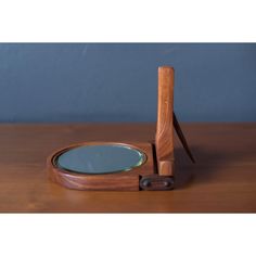 a wooden table with a magnifying glass on it