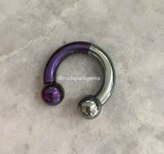 I decided to combine two of my most popular colors together into one titanium septum ring that is anodized Half Silver and Half Dark Purple. The jewelry is hand-anodized by me, and it's made of solid titanium. The anodized coloring is achieved with electricity instead of dyes or paints. That means the color will not chip off or irritate your skin. Your jewelry will be made to order to match the colors pictured in this listing. The price is for a SINGLE barbell. * Internally threaded * Both ends unscrew * Choose ball or spike ends * Choose from:      - 12 gauge (2.0mm)      - 10 gauge (2.5mm)      - 8 gauge (3.0mm)      - 7 gauge (3.5mm)      - 6 gauge (4.0mm)      - 5 gauge (4.5mm)      - 4 gauge (5.0mm) * High quality titanium: Ti-6AL-4V-ELI ASTM F136 For more reference photos of specific 4g Septum, 8g Septum, 6g Septum, 10g Septum, 12g Septum, Septum Piercing Jewelry, Belly Button Jewelry, Cool Piercings, Circular Barbell