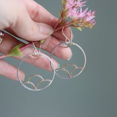 Inspired by Japanese flower print designs, these hammered wire dangle earrings are pretty and feminine, with whimsical bohemian flair. Approximately 1.5" long, not including the french hook ear wires Available in sterling silver, sterling silver & 14k gold fill mix, and in 14k gold fill. All Rebecca Haas Jewelry is handcrafted by me in my Southern Vermont Studio from recycled and ethically sourced materials. Bohemian Silver Earrings In 14k Gold Filled, Silver Bohemian Earrings With 14k Gold Filling, Southern Vermont, Japanese Flower, Japanese Flowers, Flower Print, Ear Wires, Vermont, Flower Prints