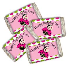 three pink birthday candy bars with ladybug on them