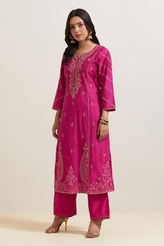 Pink natural weaves chanderi silk kurta with contrast paisley and floral embroidery. Comes with pant and shimmer organza dupatta.
Components: 3
Pattern: Embroidered
Type Of Work: Floral and Paisley
Neckline: Notched
Sleeve Type: Three Quarter
Fabric: Chanderi Silk, Shimmer Organza
Color: Pink
Other Details: 
Embroidered hem pant
Fringed border dupatta
Occasion: Puja - Aza Fashions Art Silk Palazzo Set With Chikankari Embroidery, Festival Semi-stitched Tussar Silk Palazzo Set, Festive Tussar Silk Palazzo Set With Straight Kurta, Festive Semi-stitched Tussar Silk Palazzo Set, Semi-stitched Tussar Silk Palazzo Set For Festivals, Bollywood Style Slub Silk Kurta With Resham Embroidery, Straight Kurta Churidar With Resham Embroidery In Slub Silk, Designer Tussar Silk Palazzo Set For Diwali, Bollywood Raw Silk Kurta With Cutdana