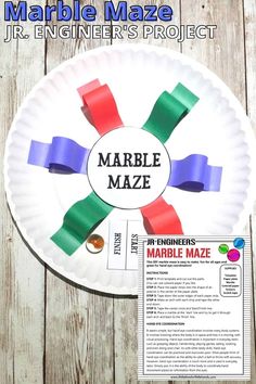 a paper plate with some colored tape on it and the words marble maze in front of it