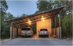 two cars are parked in a carport with lights on