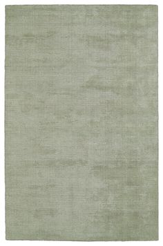 an area rug with light green colors