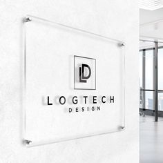 the logo for logtech design is displayed in front of an office door and glass wall