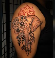 an elephant with flowers on it's head