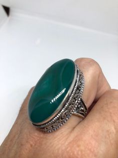 Large green agate Ornate German Silver Vintage ring, does not tarnish Size 9 can be re sized, my jeweler charges a $10 - $15 fee All rings are shipped in a nice gift box. Check out our over a THOUSAND great reviews Engraving is $4 per letter and is not always perfect depending on the piece. It can take a few days if the jeweler is busy. This is payable to Paypal Judithsltd@gmail.com Green Agate Oval Rings, Green Oval Agate Rings, Green Oval Cabochon Ring For Gift, Green Onyx Rings For Gift, Spiritual Green Ring With Large Stone, Handmade Green Oval Cabochon Ring, Unique Green Nickel-free Rings, Green Crystal Ring With Large Stone For Gift, Green Onyx Gemstone Rings As Gift