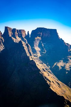 Aerial view of Cathedral Peak in Drakensberg mountains, at the Lesotho border in KwaZulu-Natal province, South Africa royalty free stock photo Mountains Background, Nature Painting, Vector Character, Nature Paintings, Outdoor Photography, Aerial View, Mother Nature