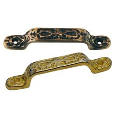 two antique brass drawer pulls on white background