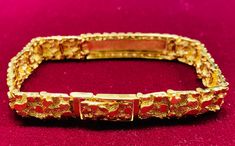 This is a nice Nugget style bracelet 14K Yellow gold. Precious Metal: 14 Karat Yellow Gold. Gemstone: None Available Size: Length: 8.5 inches. Width: 11.67 mm. Available Weight: ~37.5 grams* This bracelet is made to order, please allow additional 7 business days to process your order. May be available in other sizes. Please inquire. *All weights are approximate. **Pendant sold separately. Please contact us if you have further questions about alternate sizes or styles, availability, specification Popular Jewelry, Precious Metal, Fashion Bracelets, Precious Metals, Bangles, Yellow Gold, Bracelet, Gemstones, Pendant