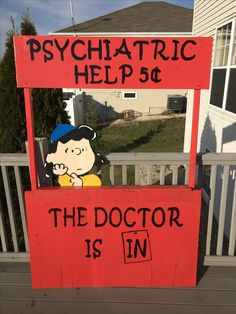 a sign that says, psychic help 50 the doctor is in with peanuts on it