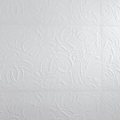 white textured wallpaper with an intricate design on it's surface, as well as the background