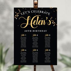 a black and gold celebration table plan on a easel