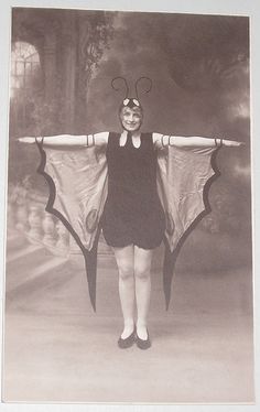 a woman wearing a butterfly costume with wings