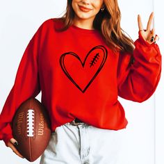 Football Heart Red Sweatshirt - Limeberry Designs Red Sweatshirt For Sports Season Fan Merchandise, Red Sweatshirt For Sports Fan Merchandise, Red Team Spirit Tops For Fall, Red Sweatshirt For Sports Events With Team Name, Red Game Day Sweatshirt Fan Apparel, Red Team Name Sweatshirt For Sports Season, Red Sweatshirt With Team Name For Sports Season, Red Fan Apparel Sweatshirt For Game Day, Red T-shirt For Fall Game Day