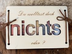 a wooden sign with the words niches written on it