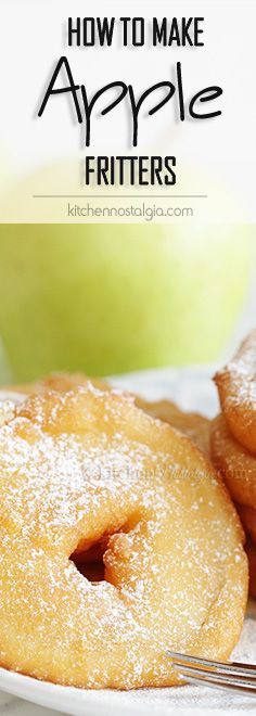 an apple is sitting on a plate next to some sugared donuts and a green apple