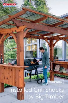 a man grilling on an outdoor bbq with the words installed grill shacks by big timber