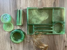 there is a green tray and other items on the table