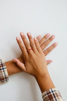 The Emilee Gold Ring Set was made to be admired and that's exactly what will happen when you head out wearing them! This set of three rings feature varying shapes and textures with rhinestones & red accents. Wear the Emilee Rings separately or stack them all together, either way you'll love them! Gold Plated Rhinestones Set of 3 Ring Sizes Vary 6.5 - 7.5 Red Minimalist Stackable Jewelry, Minimalist Red Stackable Rings, Red Minimalist Promise Ring, Minimalist Red Promise Ring, Red Round Ring For Everyday, Everyday Red Round Ring, Everyday Minimalist Red Rings, Red Stackable Open Ring Jewelry, Red Open Enamel Ring