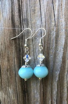 These beautiful earrings are perfect for a bride's "something blue" on her special day! They are also great for everyday wear or a night out!    Earrings measure 1" (approx. 2.5 cm) in length and feature light teal glass beads, clear Swarovski crystals, and silver accents, on silver fishhook earwires.  Orders typically ship out within 1-2 business days after payment has cleared.    Thank you for stopping by! I'm adding new items regularly so please favorite my shop if you see anything you like! Teal Glass, Light Teal, Feature Light, Etsy Earrings Dangle, Silver Accents, Something Blue, Beautiful Earrings, New Items, Favorite Jewelry