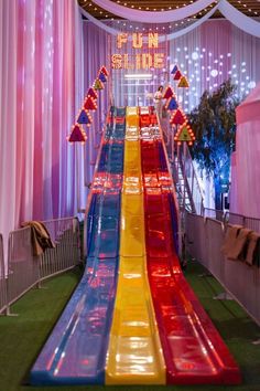 an inflatable slide is on display at a children's birthday party