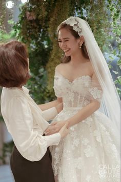 the bride is getting ready to walk down the aisle