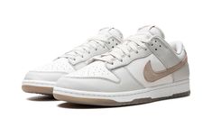 The Nike Dunk Low SE “Phantom/Khaki” is a colorway of the retro basketball shoe with a clean and easy-wearing design.  The upper is complete with a white leather base and Phantom-colored leather overlays.  A hairy suede Khaki Swoosh can be found on the sides, while “Nike” branding is embroidered on the heel.  A “Nike” and Swoosh logo also appear on the tongue tag.  Underfoot, a white rubber midsole and Khaki rubber outsole completes the look.  Release date: April 2, 2024 Jordan Golf, Nike X Travis Scott, Retro Basketball Shoes, Jordans Women, Asics Shoes, Dunks Nike, Adidas Kids, Kids Uggs, Yeezy Shoes