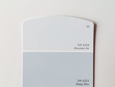 a white and gray paint swatch with the same color