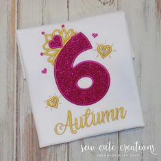 a birthday shirt with the number six in gold and pink glitter on it's chest