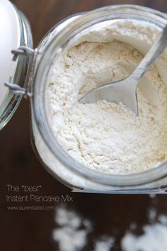 a spoon in a jar filled with white powder