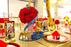 the table is set with red and gold decorations