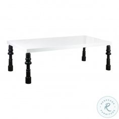 a white table with black legs and a logo on the bottom that says,'it is