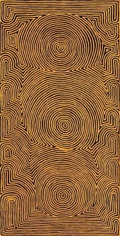 an intricately designed square with spirals in gold and black on a brown background