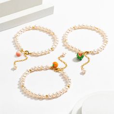 This high end enamel pearl bracelet belongs to the fruit pearl bracelet set from the Nature Jewelry collection. Comprised of a string of freshwater cultured pearls of beautiful luster, alternating with four high polished beads, and an extension chain, this bracelet distinguishes itself from other bracelets by its adorable fruit pendent which is vivid and glowing, exhibiting porcellaneous luster because of fine enamel craft. Very nice and attractive gift for women.   See   More   Fruit   Jewelry Elegant Pearl Bracelet With Colorful Beads, Pearl White Bracelet With Pearl Pendant As Gift, Elegant Pearl Bracelets With Colorful Beads, Pearl Charm Beaded Bangle Bracelet As Gift, Beaded Bangle Bracelet With Pearl Charm As Gift, Gift Beaded Bangle Bracelet With Pearl Charm, Pearl White Beaded Baroque Pearl Bracelets As Gift, Elegant White Pearl Bracelet With Colorful Beads, Gift Baroque Pearl Beaded Bracelet With Pearl Charm