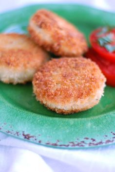 chicken croquettes on a green plate with tomatoes