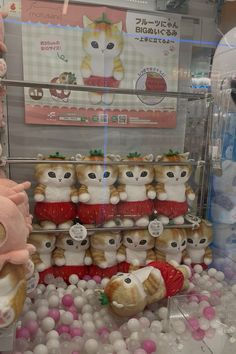 there are many stuffed animals on display in the store