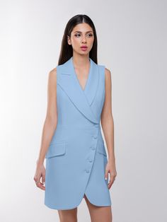 This blazer mini dress offers a chic take on power dressing with its structured cut that delivers timeless elegance, while its asymmetric lapels and double-breasted button closure add a contemporary touch.  The design is cinched at the waist and detailed with flap pockets to create an elegant, structured silhouette. Mindfully made from a luxurious stretch crêpe fabric, it is fully lined with silky satin for a smooth glide.  It is a sartorial chameleon, perfect for those who love their fashion wi Notch Lapel Mini Dress With Buttons For Party, Fitted Single Breasted Mini Dress With Notch Lapel, Fitted Notch Lapel Single Breasted Mini Dress, Fitted Mini Dress With Notch Lapel And Buttons, Chic Mini-length Blazer Dress For Semi-formal Occasions, Fitted Mini Dress With Buttons And Notch Lapel, Chic Mini Length Blazer Dress For Semi-formal Occasions, Chic Semi-formal Mini Blazer Dress, Chic Mini Blazer Dress For Semi-formal Occasions