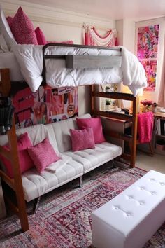 a bunk bed with futon underneath it in a room filled with pink and white furniture