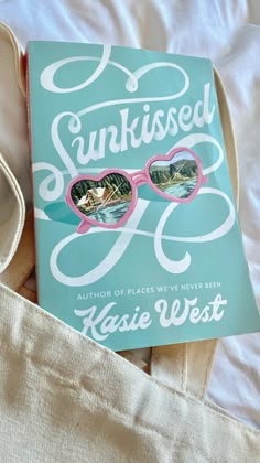 the book sunkied by kasie west is laying on top of a bed