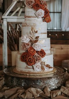 a three tiered cake with flowers on it