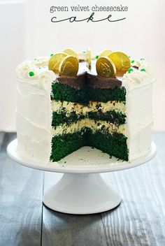 a green velvet cheesecake on a white cake stand