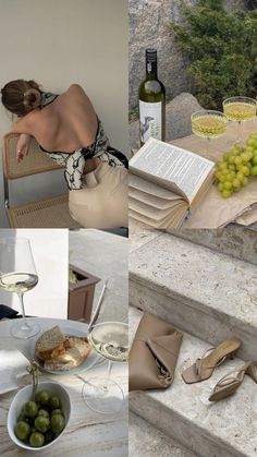 a woman sitting at a table with some wine and food on it, while reading a book