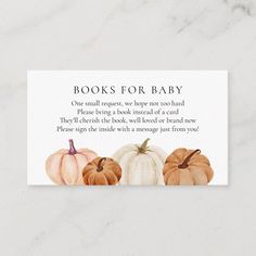 a white card with three pumpkins and the words books for baby