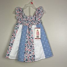 New With Tags Penelope Mack Red White Blue Floral Dress. Comprised Of Different Fabrics. Sleeveless. Smocked At Chest And Lined. Size 18 Months Patriotic And Perfect For The Fourth Of July! 100% Cotton Lining 80% Cotton 20% Poly Smoke Free Home Thank You So Much For Visiting My Closet! Bundle And Save! I Love Offers! Please Keep In Mind That Poshmark Takes A Flat Fee Of $2.95 On All Orders Under $15. For Orders Over $15, Poshmark Takes A 20% Commission. Shop With Confidence. I Have A 5 Seller Ra Cute Blue Holiday Dress, Casual White Sundress For Dress-up, Blue Ruffled Dress For Holiday, Holiday Blue Ruffled Dress, Blue Holiday Dress With Ruffles, Blue Holiday Dresses With Ruffles, Blue Cotton Sundress For Playtime, Blue Summer Dress For Playtime, White Casual Sundress For Playtime