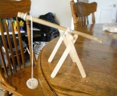 a wooden table with some white sticks sticking out of it