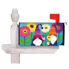 a mailbox with gnomes and flowers painted on it